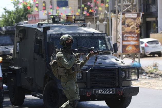 Israeli Forces Conduct Raid in Central Market Area of Nablus NABLUS, WEST BANK JUNE 14, 2026: Israeli soldiers are seen in the central vegetable market area during a military raid in the city of Nablus, in the occupied West Bank. NABLUS Palestine, State of Copyright: x xJNAxEDITORx xJNAxPressx