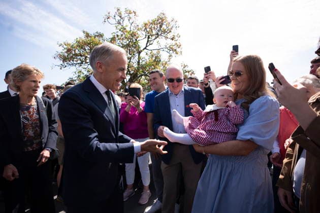June 14, 2026, Aghagower, County Mayo, Ireland: Prime Minister Mark Carney greets nine-month old Lily Besquel Meskell, in Aghagower, County Mayo, Ireland, on Sunday, June 14, 2026. Aghagower, County Mayo Ireland  - ZUMAc35_ 20260614_zaf_c35_035 Copyright: xChristopherxKatsarovx