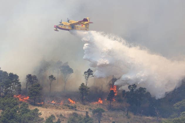 Wildfire continues to burn in Sicily s Trapani region as aerial response intensifies TRAPANI, ITALY - JUNE 14: Firefighting aircraft and helicopters operate to extinguish a wildfire that broke out in a maquis area near the Grande Montagna location in Trapani, on the west of Italy s Sicily Island, on June 14, 2026. The wildfire, which started yesterday afternoon, continues to spread despite ongoing aerial and ground efforts. Alberto Lo Bianco Anadolu Trapani Italy. Editorial use only. Please get in touch for any other usage.  Copyright: x2026xAnadoluxAlbertoxLoxBiancox