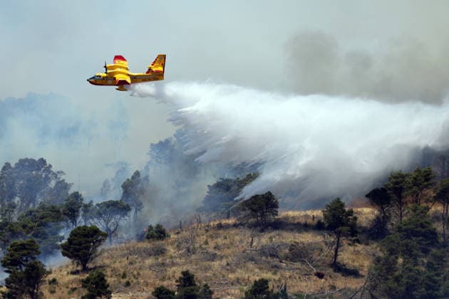 Wildfire continues to burn in Sicily s Trapani region as aerial response intensifies TRAPANI, ITALY - JUNE 14: Firefighting aircraft and helicopters operate to extinguish a wildfire that broke out in a maquis area near the Grande Montagna location in Trapani, on the west of Italy s Sicily Island, on June 14, 2026. The wildfire, which started yesterday afternoon, continues to spread despite ongoing aerial and ground efforts. Alberto Lo Bianco Anadolu Trapani Italy. Editorial use only. Please get in touch for any other usage.  Copyright: x2026xAnadoluxAlbertoxLoxBiancox