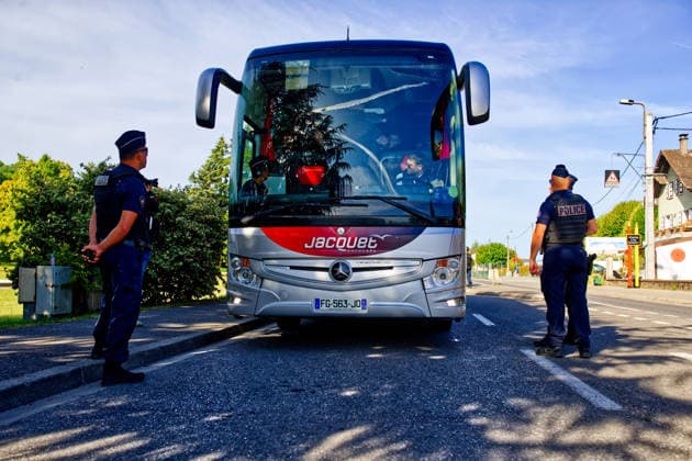June 14, 2026, Publier, Haute-Savoie, France: PUBLIER, FRANCE - JUNE 14, 2026: French National Police officers conduct security checks on board a bus in Publier, near the official Evian G7 summit media center, inspecting passengers passes and identification. French authorities have reinforced security measures and screening protocols on transport services and surrounding areas to maintain public order during the international event. Publier France  - ZUMAc267 20260614_zip_c267_003 Copyright: xMarcoxCordonex