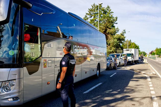 June 14, 2026, Publier, Haute-Savoie, France: PUBLIER, FRANCE - JUNE 14, 2026: French National Police officers conduct security checks on board a bus in Publier, near the official Evian G7 summit media center, inspecting passengers passes and identification. French authorities have reinforced security measures and screening protocols on transport services and surrounding areas to maintain public order during the international event. Publier France - ZUMAc267 20260614_zip_c267_004 Copyright: xMarcoxCordonex