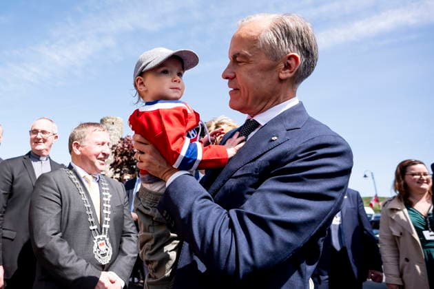 June 14, 2026, Aghagower, County Mayo, Ireland: Prime Minister Mark Carney hoists Malachy Morgan wearing a Montreal CanadiensöÄÃ jersey, in Aghagower, County Mayo, Ireland, on Sunday, June 14, 2026. Aghagower, County Mayo Ireland  - ZUMAc35_ 20260614_zaf_c35_041 Copyright: xChristopherxKatsarovx
