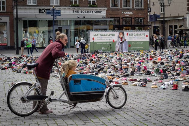Commemoration in Bosch for Palestinian children and journalists killed by Israel BOSCH, NETHERLANDS - JUNE 14: Photographs and names of journalists killed in the Israeli attacks on Gaza, and thousands of children’s shoes are displayed during a commemoration event held for Palestinian children and journalists killed in Israel’s attacks on Gaza in Bosch, Netherlands on June 14, 2026. Organized by the Plant an Olive Tree Foundation in Markt Square in the city center of Den Bosch, the event honored Palestinian children and journalists who lost their lives in Israeli attacks in Gaza. Abdullah Asiran Anadolu Bosch Netherlands. Editorial use only. Please get in touch for any other usage.  Copyright: x2026xAnadoluxAbdullahxAsiranx