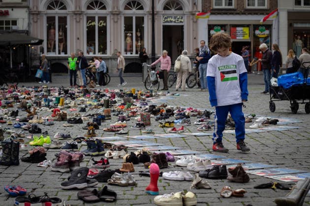 Commemoration in Bosch for Palestinian children and journalists killed by Israel BOSCH, NETHERLANDS - JUNE 14: Photographs and names of journalists killed in the Israeli attacks on Gaza, and thousands of children’s shoes are displayed during a commemoration event held for Palestinian children and journalists killed in Israel’s attacks on Gaza in Bosch, Netherlands on June 14, 2026. Organized by the Plant an Olive Tree Foundation in Markt Square in the city center of Den Bosch, the event honored Palestinian children and journalists who lost their lives in Israeli attacks in Gaza. Abdullah Asiran Anadolu Bosch Netherlands. Editorial use only. Please get in touch for any other usage.  Copyright: x2026xAnadoluxAbdullahxAsiranx