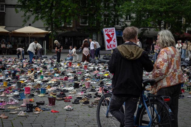 Commemoration in Bosch for Palestinian children and journalists killed by Israel BOSCH, NETHERLANDS - JUNE 14: Photographs and names of journalists killed in the Israeli attacks on Gaza, and thousands of children’s shoes are displayed during a commemoration event held for Palestinian children and journalists killed in Israel’s attacks on Gaza in Bosch, Netherlands on June 14, 2026. Organized by the Plant an Olive Tree Foundation in Markt Square in the city center of Den Bosch, the event honored Palestinian children and journalists who lost their lives in Israeli attacks in Gaza. Abdullah Asiran Anadolu Bosch Netherlands. Editorial use only. Please get in touch for any other usage.  Copyright: x2026xAnadoluxAbdullahxAsiranx