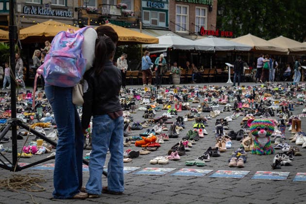 Commemoration in Bosch for Palestinian children and journalists killed by Israel BOSCH, NETHERLANDS - JUNE 14: Photographs and names of journalists killed in the Israeli attacks on Gaza, and thousands of children’s shoes are displayed during a commemoration event held for Palestinian children and journalists killed in Israel’s attacks on Gaza in Bosch, Netherlands on June 14, 2026. Organized by the Plant an Olive Tree Foundation in Markt Square in the city center of Den Bosch, the event honored Palestinian children and journalists who lost their lives in Israeli attacks in Gaza. Abdullah Asiran Anadolu Bosch Netherlands. Editorial use only. Please get in touch for any other usage.  Copyright: x2026xAnadoluxAbdullahxAsiranx