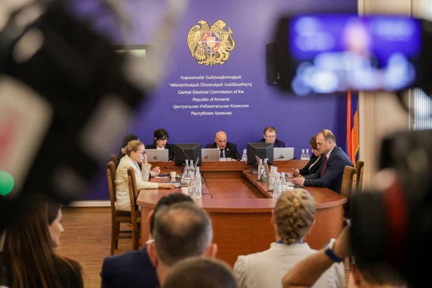 ARMENIA, YEREVAN - JUNE 14, 2026: President of the Central Election Commission of Armenia Vahagn Hovakimyan (C back) and Secretary of the Central Election Commission of Armenia Armen Smbatyan (R back) are seen in the offices of the Central Electoral Commission of Armenia during the announcement of the results of the 2026 Armenian parliamentary election Yerevan Armenia  - ZUMAt113 20260614_zaa_t113_101 Copyright: xAlexanderxPatrinx