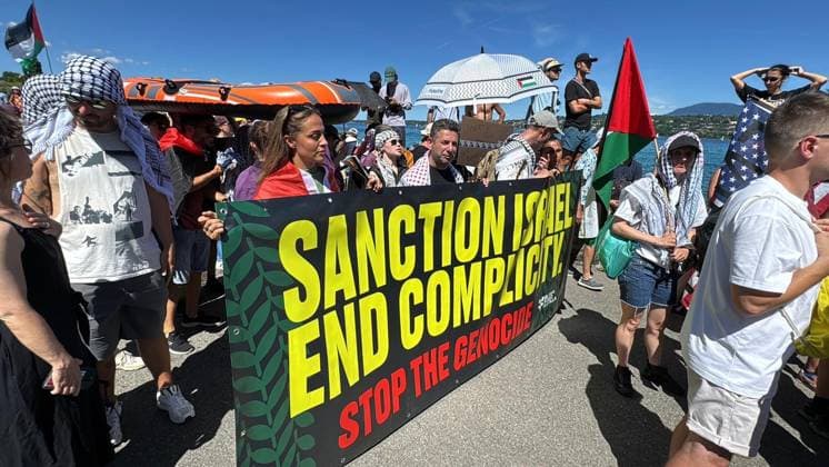 Anti-G7 demonstration held in Geneva GENEVA, SWITZERLAND - JUNE 14: Protesters hold placards and banners as they march along a street during a demonstration against the upcoming G7 Summit at Mon Repos Park in Geneva, Switzerland on June 14, 2026. The protest was organized ahead of the G7 Summit scheduled to begin tomorrow in France. Muhammet Ikbal Arslan Anadolu Geneva Switzerland. Editorial use only. Please get in touch for any other usage.  Copyright: x2026xAnadoluxMuhammetxIkbalxArslanx