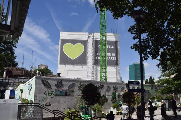 June 14, 2026, London, United Kingdom: People gather at the memorial wall next to the remains of Grenfell Tower which is undergoing demolition on the ninth anniversary of the disaster. 72 people died when a fire broke out in the block of flats in North Kensington in 2017. London United Kingdom  - ZUMAs197 20260614_aab_s197_003 Copyright: xVukxValcicx