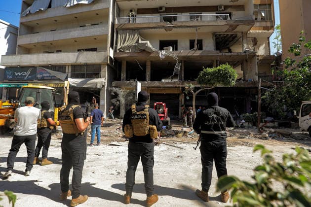 June 14, 2026, Beirut, Beirut, Lebanon: Members of Lebanese army intelligence secures that site of a building was targeted by Israeli strike in Beirut southern suburb, a bastion of pro-Iranian Hezbollah. Three people were killed in the attack, according to Lebanon s state media. The Israel Defense Forces (IDF) said it targeted a command center used by Hezbollah after the Iran-backed armed group launched aerial targets toward Israel Beirut Lebanon  - ZUMAn313 20260614_zip_n313_011 Copyright: xMarwanxNaamanix