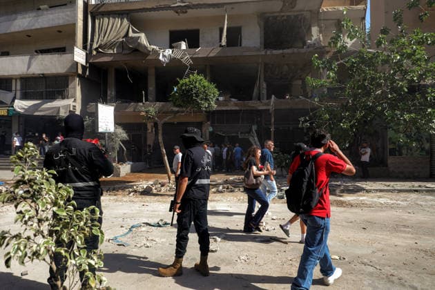 June 14, 2026, Beirut, Beirut, Lebanon: Members of Lebanese army intelligence secures that site of where a building was targeted by Israeli strike in Beirut southern suburb, a bastion of pro-Iranian Hezbollah, as residents of a nearby building walk among debris. Three people were killed in the attack, according to Lebanon s state media. The Israel Defense Forces (IDF) said it targeted a command center used by Hezbollah after the Iran-backed armed group launched aerial targets toward Israel Beirut Lebanon  - ZUMAn313 20260614_zip_n313_006 Copyright: xMarwanxNaamanix