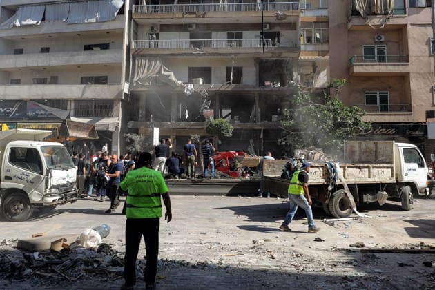 June 14, 2026, Beirut, Beirut, Lebanon: Municipality workers clear rubble in front of a building was targeted by Israeli strike in Beirut southern suburb, a bastion of pro-Iranian Hezbollah Three people were killed in the attack, according to Lebanon s state media. The Israel Defense Forces (IDF) said it targeted a command center used by Hezbollah after the Iran-backed armed group launched aerial targets toward Israel Beirut Lebanon  - ZUMAn313 20260614_zip_n313_008 Copyright: xMarwanxNaamanix