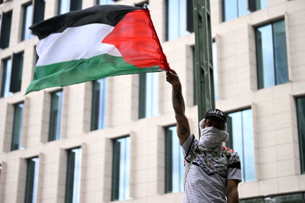 Anti-war march held in Brussels BRUSSELS, BELGIUM - JUNE 14: A protester waves a Palestinian flag as thousands of people take part in an anti-war march in Brussels, Belgium on June 14, 2026. Demonstrators gathered at Brussels North Railway Station (Gare du Nord), a city that hosts EU institutions and NATO headquarters, before marching to Jean Rey Square. Dursun Aydemir Anadolu Brussels Belgium. Editorial use only. Please get in touch for any other usage.  Copyright: x2026xAnadoluxDursunxAydemirx