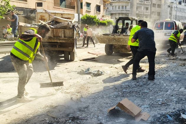 LEBANON, BEIRUT - JUNE 14, 2026: Clearing rubble outside an apartment building south of Beirut after an airstrike. Ankhar Kochneva TASS  93809754