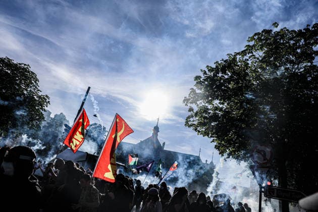 June 14, 2026, Geneva, Switzerland, European Union: Streaks of tear gas shots shot by police can be seen in the sky as protesters run during a demonstration in Geneva ahead of the G7 summit. Geneva European Union  - ZUMAo116 20260614_znp_o116_012 Copyright: xBiancaxOterox