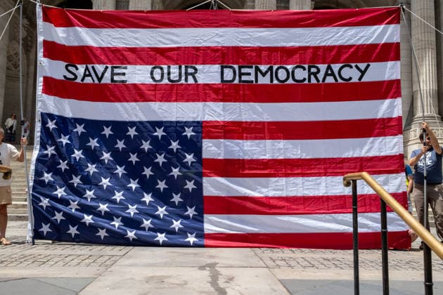 June 14, 2026, New York, New York, USA: Activist group Rise and Resist fly a giant 12x18 upside-down American flag on the steps of the New York Public Library as part of their protest demanding to Ã¢â‚¬oeImpeach, Convict and RemoveÃ¢â‚¬Â PRESIDENT DONALD TRUMP from office. New York USA  - ZUMAp288 20260614_znp_p288_002 Copyright: xSyndixPilarx