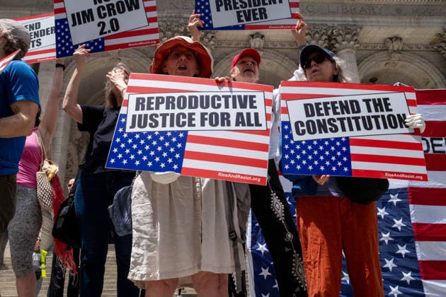 June 14, 2026, New York, New York, USA: Activist group Rise and Resist protest on the steps of the New York Public Library demanding to Ã¢â‚¬oeImpeach, Convict and RemoveÃ¢â‚¬Â PRESIDENT DONALD TRUMP from office. New York USA  - ZUMAp288 20260614_znp_p288_005 Copyright: xSyndixPilarx