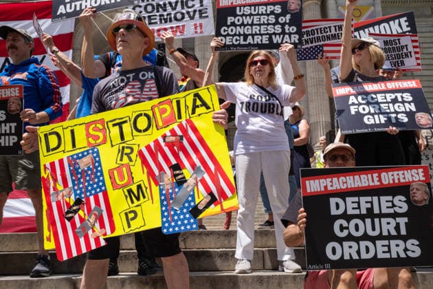 June 14, 2026, New York, New York, USA: Activist group Rise and Resist protest on the steps of the New York Public Library demanding to Ã¢â‚¬oeImpeach, Convict and RemoveÃ¢â‚¬Â PRESIDENT DONALD TRUMP from office. New York USA  - ZUMAp288 20260614_znp_p288_003 Copyright: xSyndixPilarx