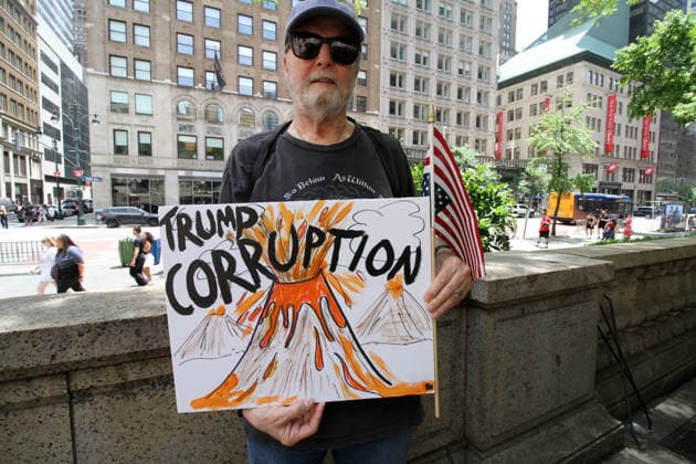 June 14, 2026, Manhattan, New York, USA: New York, New York June 14,.2026... The group Rise and Resist today protested President Trump by flying a 12 x 18 foot Ã¢â‚¬oedistressedÃ¢â‚¬Â American flag in front of a place free of Trump & Republicans, the steps of the New York Public Library. Manhattan USA  - ZUMAct2_ 20260614_faf_ct2_023 Copyright: xBrucexCotlerx