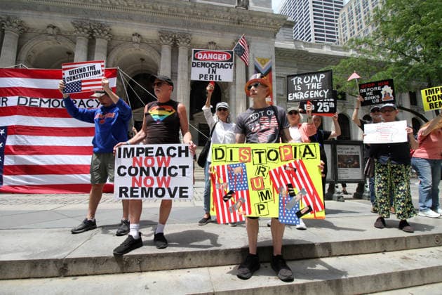 June 14, 2026, Manhattan, New York, USA: New York, New York June 14,.2026... The group Rise and Resist today protested President Trump by flying a 12 x 18 foot Ã¢â‚¬oedistressedÃ¢â‚¬Â American flag in front of a place free of Trump & Republicans, the steps of the New York Public Library. Manhattan USA  - ZUMAct2_ 20260614_faf_ct2_024 Copyright: xBrucexCotlerx