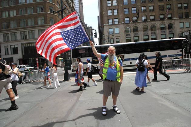 June 14, 2026, Manhattan, New York, USA: New York, New York June 14,.2026... The group Rise and Resist today protested President Trump by flying a 12 x 18 foot Ã¢â‚¬oedistressedÃ¢â‚¬Â American flag in front of a place free of Trump & Republicans, the steps of the New York Public Library. Manhattan USA  - ZUMAct2_ 20260614_faf_ct2_038 Copyright: xBrucexCotlerx