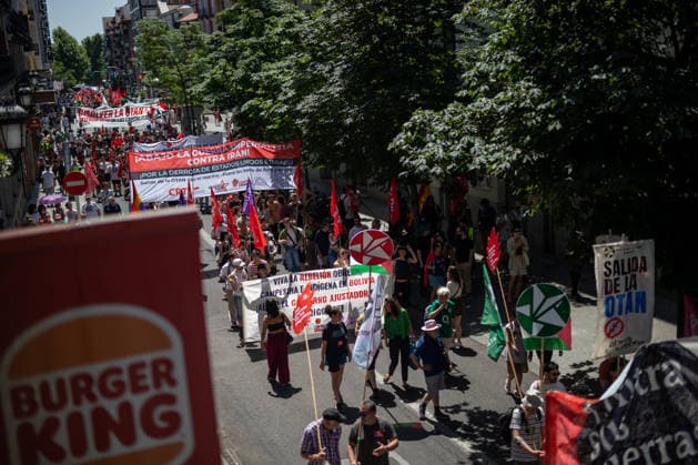 June 14, 2026, Madrid, Spain: A crowd of protesters march with banners along a street in Madrid during a demonstration against rearmament and imperialist war The demonstration takes place against the backdrop of an international escalation of military tensions, fueled by the â‚¬800 billion RearmEurope plan presented by Ursula von der Leyen. Madrid Spain  - ZUMAs197 20260614_aaa_s197_213 Copyright: xDavidxCanalesx