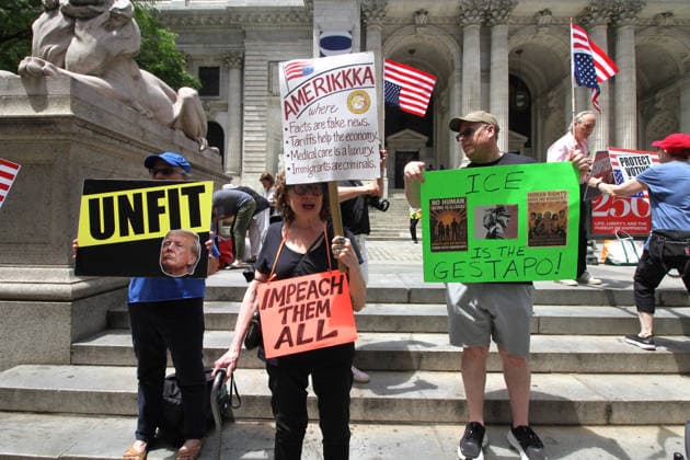 June 14, 2026, Manhattan, New York, USA: New York, New York June 14,.2026... The group Rise and Resist today protested President Trump by flying a 12 x 18 foot Ã¢â‚¬oedistressedÃ¢â‚¬Â American flag in front of a place free of Trump & Republicans, the steps of the New York Public Library. Manhattan USA  - ZUMAct2_ 20260614_faf_ct2_040 Copyright: xBrucexCotlerx