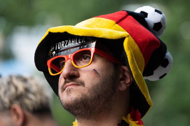 June 14, 2026, Frankfurt, Hesse, Germany: A fan watches the live broadcast of the FIFA World Cup match between Germany and Curacao in Frankfurt am Main, Germany. Frankfurt Germany - ZUMAb332 20260614_zip_b332_002 Copyright: xMatiasxBasualdox