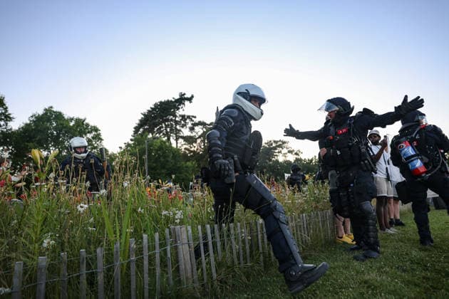 June 14, 2026, Geneva, Switzerland, European Union: Police officers move through a flower bed to form a cordon during demonstrations in Geneva ahead of the G7 summit, which begins tomorrow in Evian-les-Bains. Geneva European Union - ZUMAo116 20260614_znp_o116_036 Copyright: xBiancaxOterox