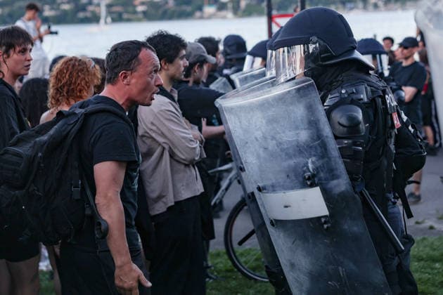 June 14, 2026, Geneva, Switzerland, European Union: A protester yells at police officers behind riot shields in which they will not let him pass during demonstrations in Geneva ahead of the G7 summit, which begins tomorrow in Evian-les-Bains, as tensions rise between protesters and security forces. Geneva European Union - ZUMAo116 20260614_znp_o116_040 Copyright: xBiancaxOterox