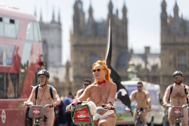 June 14, 2026, London, England, United Kingdom: Naked cyclists ride through Westminster during the annual World Naked Bike Ride, demanding greater respect for cyclists and protesting air pollution. London United Kingdom  - ZUMAs262 20260614_zip_s262_042 Copyright: xTayfunxSalcix