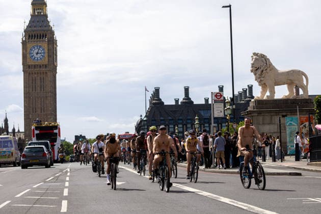 June 14, 2026, London, England, United Kingdom: Naked cyclists ride through Westminster during the annual World Naked Bike Ride, demanding greater respect for cyclists and protesting air pollution. London United Kingdom  - ZUMAs262 20260614_zip_s262_034 Copyright: xTayfunxSalcix