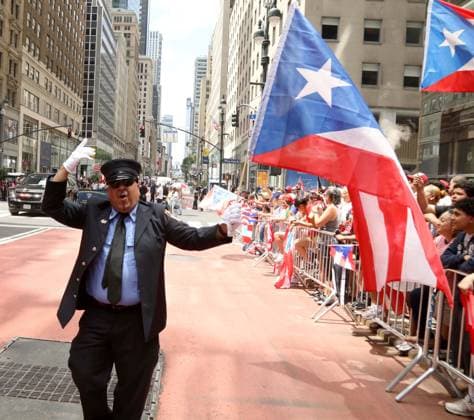 June 14, 2026, New York, New York, USA: A PARADE GOER seen at the 69th Annual National Puerto Rican Parade held on 5th Avenue. New York USA  - ZUMAk03_ 20260614_zaf_k03_048 Copyright: xNancyxKaszermanx