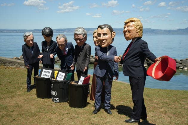 Oxfam protest ahead of G7 Summit in France EVIAN-LES-BAINS, FRANCE - JUNE 14: Activists wearing oversized papier-mache masks depicting world leaders, including U.S. President Donald Trump and French President Emmanuel Macron, take part in an Oxfam demonstration ahead of the G7 Summit in Evian-les-Bains, France, on June 14, 2026. The anti-poverty charity staged the protest to call attention to climate change and gender equality issues ahead of the gathering of G7 leaders. Stringer Anadolu Evian-les-Bains France. Editorial use only. Please get in touch for any other usage.  Copyright: x2026xAnadoluxStringerx