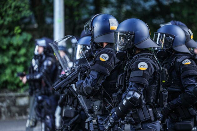 June 14, 2026, Geneva, Switzerland, European Union: Police officers in riot gear stand together as one loads a tear gas launcher during demonstrations in Geneva ahead of the G7 summit, which begins tomorrow in Evian-les-Bains. Geneva European Union  - ZUMAo116 20260614_znp_o116_048 Copyright: xBiancaxOterox