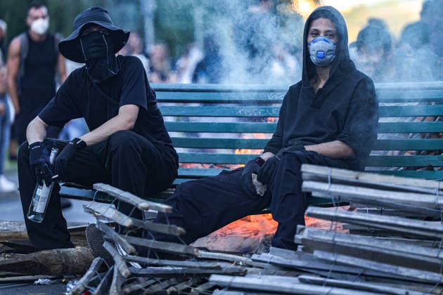June 14, 2026, Geneva, Switzerland, European Union: Young demonstrators dressed in black and wearing face masks sit on a burning bench during demonstrations in Geneva ahead of the G7 summit, which begins tomorrow in Evian-les-Bains. Geneva European Union  - ZUMAo116 20260614_znp_o116_057 Copyright: xBiancaxOterox