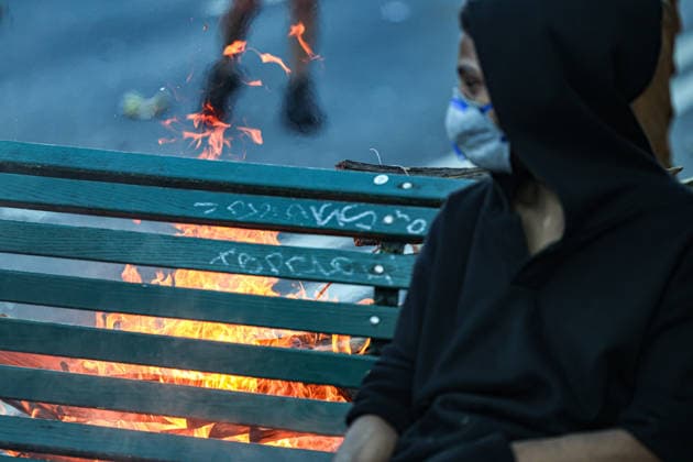 June 14, 2026, Geneva, Switzerland, European Union: Young demonstrator dressed in black and wearing face mask sits on a burning bench during demonstrations in Geneva ahead of the G7 summit, which begins tomorrow in Evian-les-Bains. Geneva European Union - ZUMAo116 20260614_znp_o116_059 Copyright: xBiancaxOterox