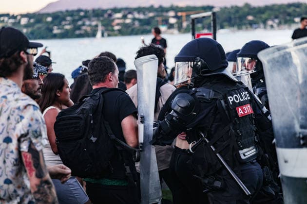 June 14, 2026, Geneva, Switzerland, European Union: A police officer with shield pushes a protester as he tries to push his way through push through a cordon of Police during demonstrations in Geneva ahead of the G7 summit. Geneva European Union  - ZUMAo116 20260614_znp_o116_069 Copyright: xBiancaxOterox
