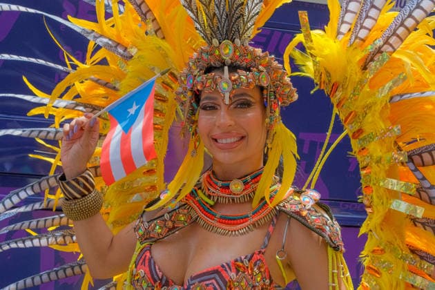 June 14, 2026, New York, New York, USA: Costumed dancer at the 69th annual Puerto Rican Day Parade which made its way up Fifth Avenue to a sea of red white and blue celebrating the expansive cultural legacy and global footprint of .Puerto Rico. Salsa music, floats, dance and Puerto Rican pride filled the air as thousands marched and.watched from the sidelines. New York USA  - ZUMAh156 20260614_znp_h156_011 Copyright: xMiloxHessx