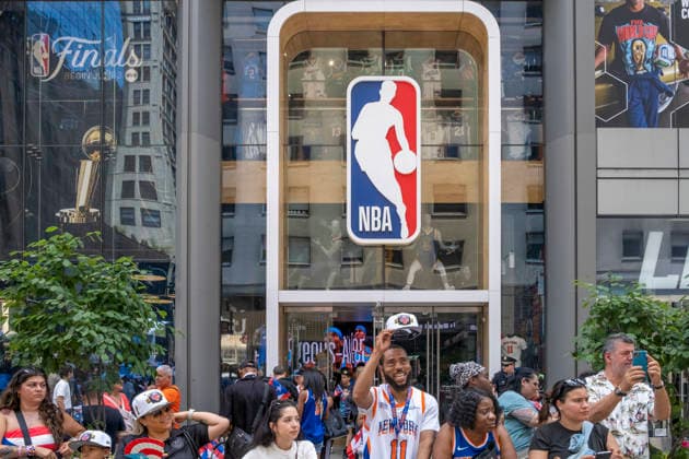 June 14, 2026, New York, New York, USA: NY Knicks pride in front of the NBA Store at the 69th annual Puerto Rican Day Parade which made its way up Fifth Avenue to a sea of red white and blue celebrating the expansive cultural legacy and global footprint of .Puerto Rico. Salsa music, floats, dance and Puerto Rican pride filled the air as thousands marched and.watched from the sidelines. New York USA  - ZUMAh156 20260614_znp_h156_012 Copyright: xMiloxHessx