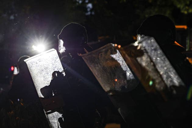 June 14, 2026, Geneva, Switzerland, European Union: Police officers in riot gear and holding shields are illuminated by a background light during demonstrations in Geneva ahead of the G7 summit, which begins tomorrow in Evian-les-Bains. Geneva European Union  - ZUMAo116 20260614_znp_o116_079 Copyright: xBiancaxOterox