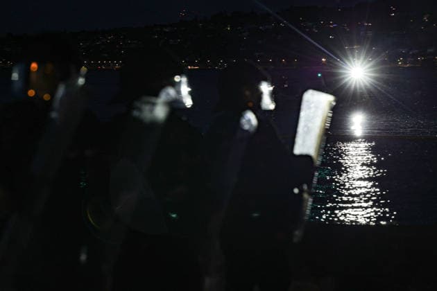 June 14, 2026, Geneva, Switzerland, European Union: Police officers in riot gear walk along Lake Geneva holding back protesters and are illuminated by a background police boat lights during demonstrations in Geneva ahead of the G7 summit, which begins tomorrow in Evian-les-Bains. Geneva European Union  - ZUMAo116 20260614_znp_o116_081 Copyright: xBiancaxOterox