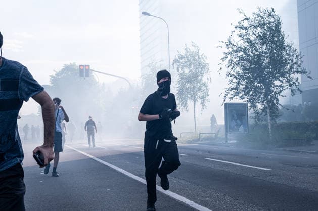 June 14, 2026, Geneva, Canton Of Geneva, Switzerland: Thousands of people took part in the NOG7 demonstration held in Geneva on 14 June. During the protest, shop windows were smashed and a car was set alight, and demonstrators clashed repeatedly with the police. The march, which set off from the lakeside, then made its way through the city centre, passing in front of the UNHCR headquarters, where clashes broke out. Geneva Switzerland - ZUMAs377 20260614_znp_s377_044 Copyright: xPietroxStariccox