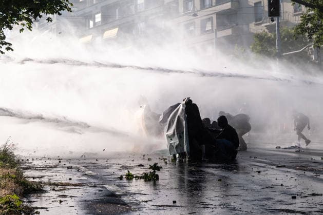 June 14, 2026, Geneva, Canton Of Geneva, Switzerland: Thousands of people took part in the NOG7 demonstration held in Geneva on 14 June. During the protest, shop windows were smashed and a car was set alight, and demonstrators clashed repeatedly with the police. The march, which set off from the lakeside, then made its way through the city centre, passing in front of the UNHCR headquarters, where clashes broke out. Geneva Switzerland - ZUMAs377 20260614_znp_s377_061 Copyright: xPietroxStariccox