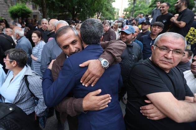 June 14, 2026, Yerevan, Armenia: Lawyer Aram Vardevanyan hugs his friend during the rally. Armenia™s Central Election Commission (CEC) has certified the results of the June 7 parliamentary elections, confirming that Prime Minister Nikol Pashinyan™s Civil Contract party secured 49.74% of the vote, enough to form a government independently without coalition partners. The Prosperous Armenia party, led by billionaire Gagik Tsarukyan, narrowly failed to clear the 4% parliamentary threshold and called on its supporters to gather outside the CEC building in protest. Opposition, rejecting the outcome as illegitimate, addressed crowds demanding a rerun of the vote. Yerevan Armenia  - ZUMAs197 20260614_aaa_s197_238 Copyright: xYanxKhachkox