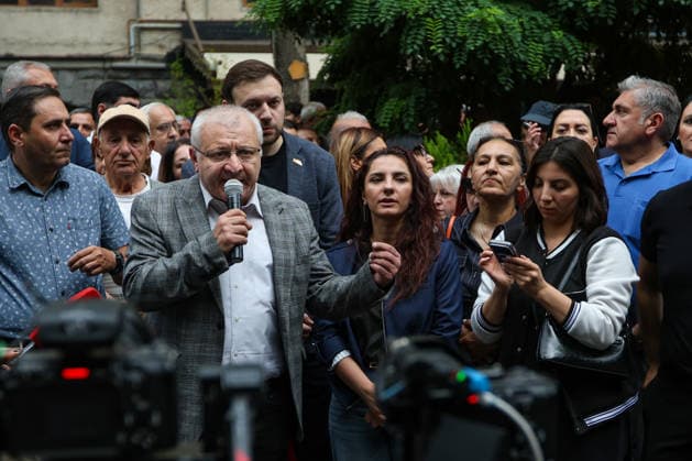 June 14, 2026, Yerevan, Armenia: Prosperous Armenia Party candidate Suren Surenyants talks to the crowd of protestors during the rally. Armenia™s Central Election Commission (CEC) has certified the results of the June 7 parliamentary elections, confirming that Prime Minister Nikol Pashinyan™s Civil Contract party secured 49.74% of the vote, enough to form a government independently without coalition partners. The Prosperous Armenia party, led by billionaire Gagik Tsarukyan, narrowly failed to clear the 4% parliamentary threshold and called on its supporters to gather outside the CEC building in protest. Opposition, rejecting the outcome as illegitimate, addressed crowds demanding a rerun of the vote. Yerevan Armenia - ZUMAs197 20260614_aaa_s197_261 Copyright: xYanxKhachkox