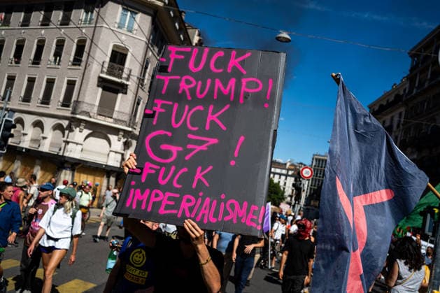 Demonstration against the G7 summit in Geneva on June 14, 2026 Nicolas Liponne MAXPPP Geneve 14 06 2026 A protester holds a sign reading Fuck Trump, Fuck the G7, and Fuck Imperialism during an international demonstration against fascism, capitalism and imperialism as part of the mobilization of the counter G7 summit, qui aura lieu à Évian du 15 au 17 juin, à Genève le 14 juin 2026 A protester holds a sign reading Fuck Trump, Fuck the G7, and Fuck Imperialism during an international demonstration against fascism, capitalism, and imperialism, as part of the mobilization for the G7 counter summit, which will take place in Évian from June 15 to 17, in Geneva on June 14, 2026 Geneve Geneve SUISSE  Copyright: xMAXPPPxNicolasxLiponnex NLP202606152295 NLP202606152295