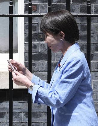Japan-Britain summit Japanese Prime Minister Sanae Takaichi (L) leaves Downing Street in London following talks with her British counterpart Keir Starmer on June 14, 2026. (Pool photo)  A14AA0005618807P