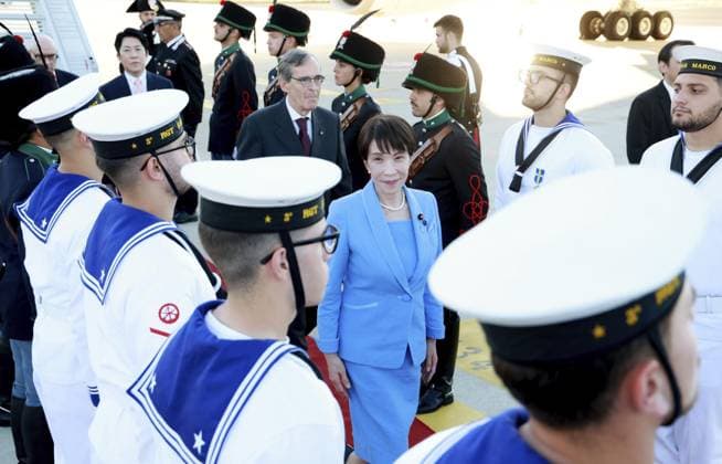 Japanese PM Takaichi arrives in Italy Japanese Prime Minister Sanae Takaichi (C) arrives at Leonardo da Vinci International Airport in Fiumicino, near Rome, on June 14, 2026. During her stay in Rome, Takaichi is scheduled to hold talks with her Italian counterpart Giorgia Meloni. (Pool photo)  A14AA0005618881P